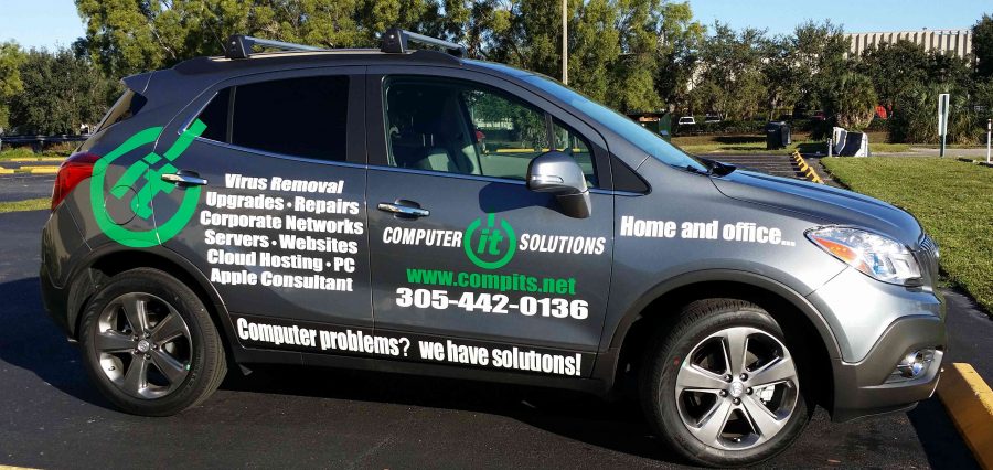 business vehicle with service posted on wrap stickers including website and office phone 305-442-0136